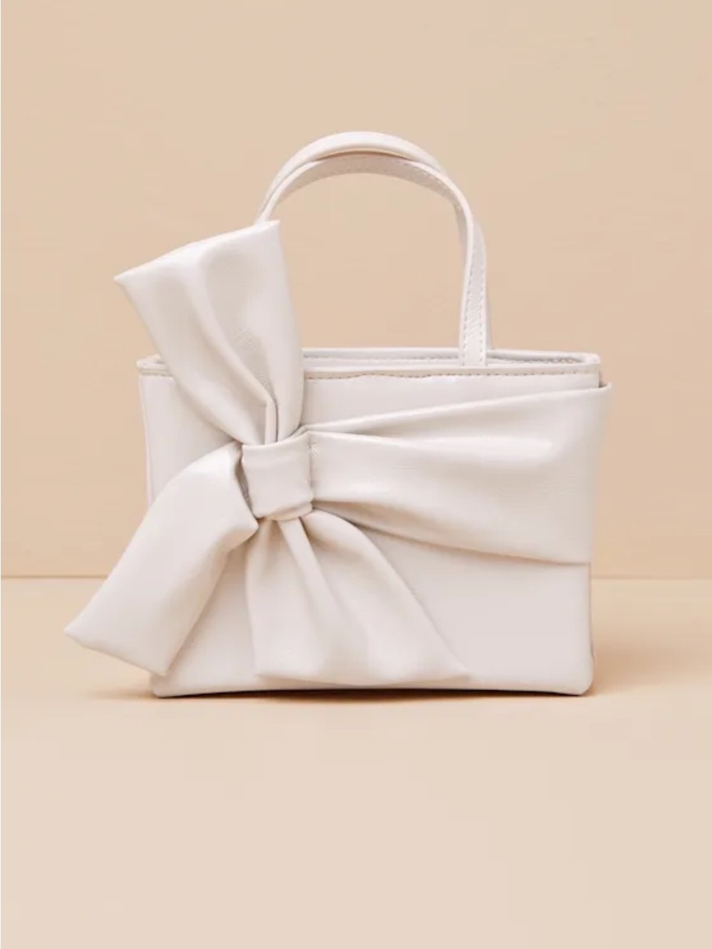 Lulu’s Licinda Ivory Bow Handbag